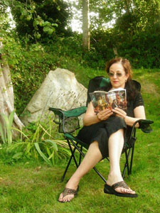 Local poet Jody Jankola reads her early copy of the new anthology of BC poetry, Rocksalt, which will be available this month.